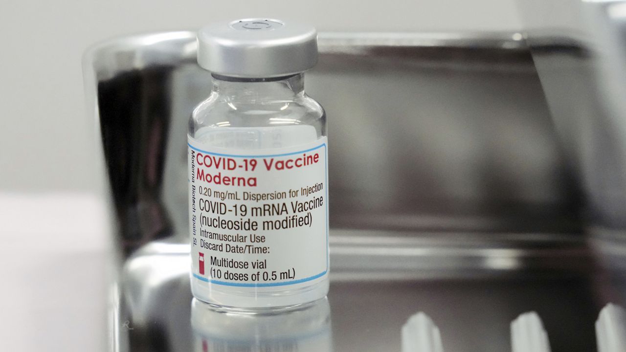 FILE - This June 14, 2021, file photo shows a vial of the Moderna COVID-19 vaccine. (AP Photo/Eugene Hoshiko, File)