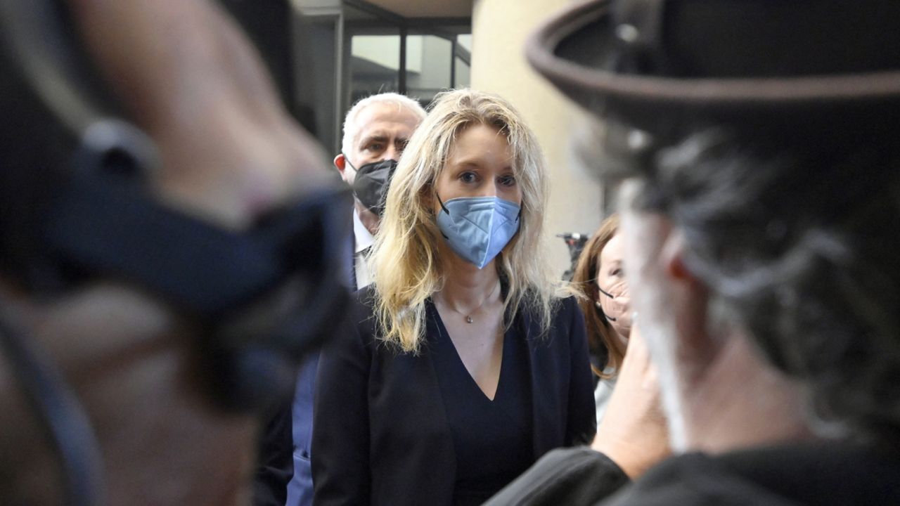 FILE: Elizabeth Holmes, founder and CEO of Theranos, arrives at the federal courthouse for jury selection in her trial, Tuesday, Aug. 31, 2021, in San Jose, Calif. (AP Photo/Nic Coury)