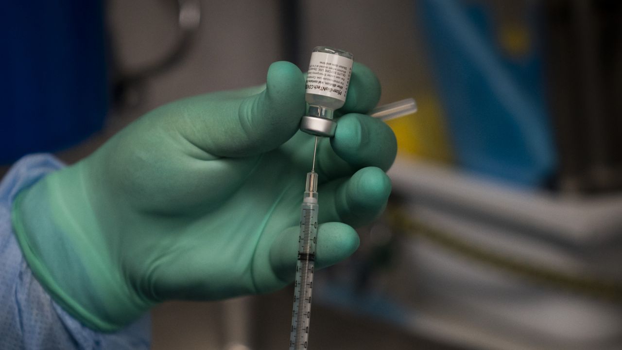 FILE - A syringe with the Pfizer COVID-19 vaccine in a mobile vaccine clinic operated by Families Together of Orange County in Santa Ana, Calif. A (AP Photo/Jae C. Hong, File)
