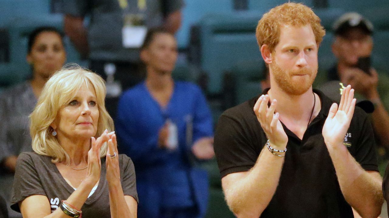FILE: Dr. Jill Biden, left, and Britain's Prince Harry applaud the athletes after the final event, a wheelchair basketball game, at the Invictus Games, Thursday, May 12, 2016, in Kissimmee, Fla. (AP Photo/John Raoux)