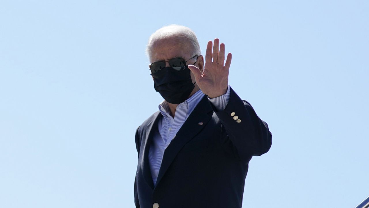 FILE: President Joe Biden waves as he exits Air Force One upon arrival at John F. Kennedy International Airport, Tuesday, Sept. 7, 2021. (AP Photo/Evan Vucci)