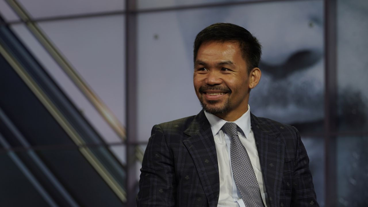 FILE: Manny Pacquiao smiles during a news conference with Errol Spence Jr. at the Fox Studios lot in Los Angeles ahead of their upcoming boxing match, taking place in Las Vegas on Aug. 21, in Los Angeles, Sunday, July 11, 2021. (AP Photo/Damian Dovarganes)