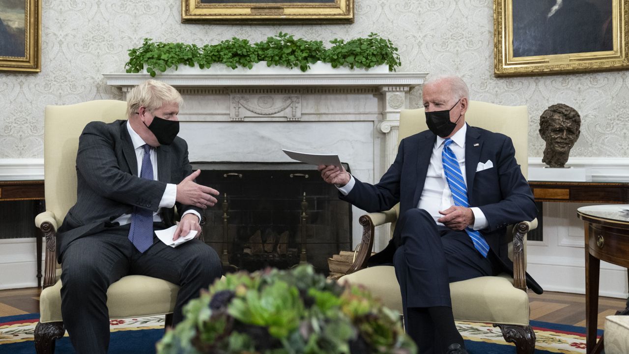 President Joe Biden, right, speaks during a meeting with British Prime Minister Boris Johnson in the Oval Office of the White House, Tuesday, Sept. 21, 2021, in Washington. (AP Photo/Alex Brandon)