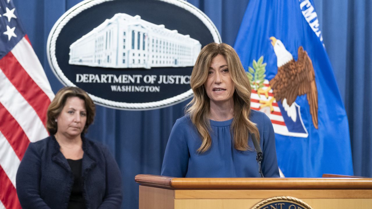 Anne Milgram, Administrator of the Drug Enforcement Administration, right, accompanied by Deputy Attorney General Lisa Monaco, speaks during a news conference at the Department of Justice, Thursday, Sept. 30, 2021, in Washington. (AP Photo/Alex Brandon)
