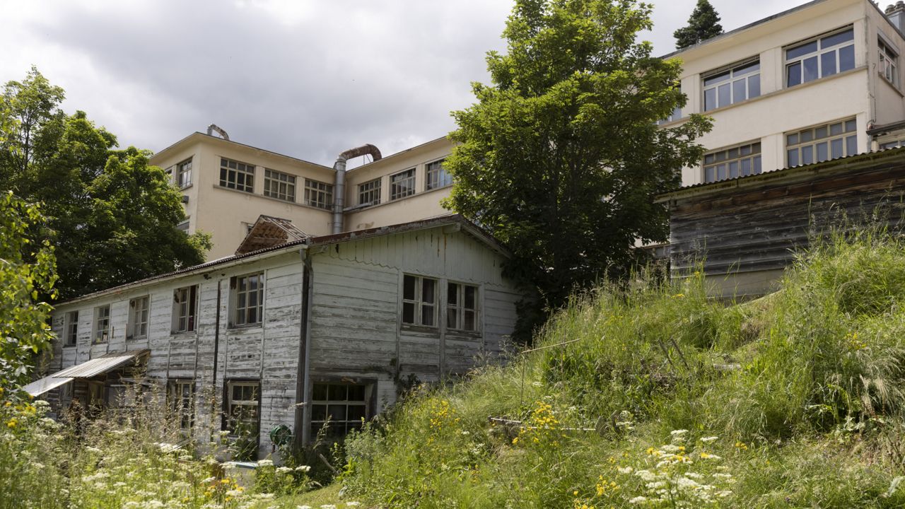This Wednesday, June 23, 2021 photo shows an abandoned music box factory in Sainte-Croix, Switzerland, where Lola Montemaggi stayed after the April abduction of her 8-year-old daughter in France. (AP Photo/Jean-Francois Badias)