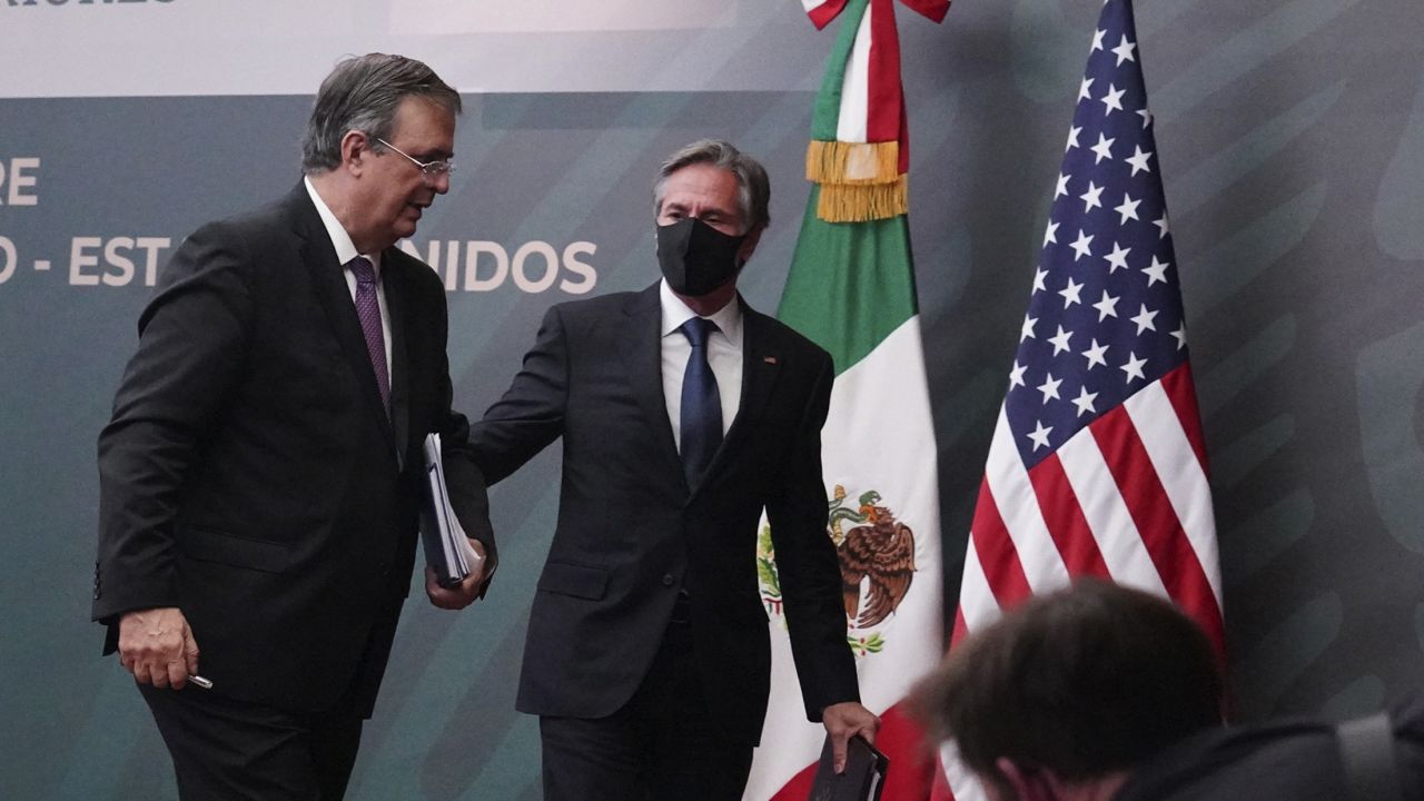 U.S. Secretary of State Antony Blinken, center, and Mexican Foreign Secretary Marcelo Ebrard at the Mexican Foreign Ministry in Mexico City, Friday Oct. 8, 2021. (AP Photo/Marco Ugarte)