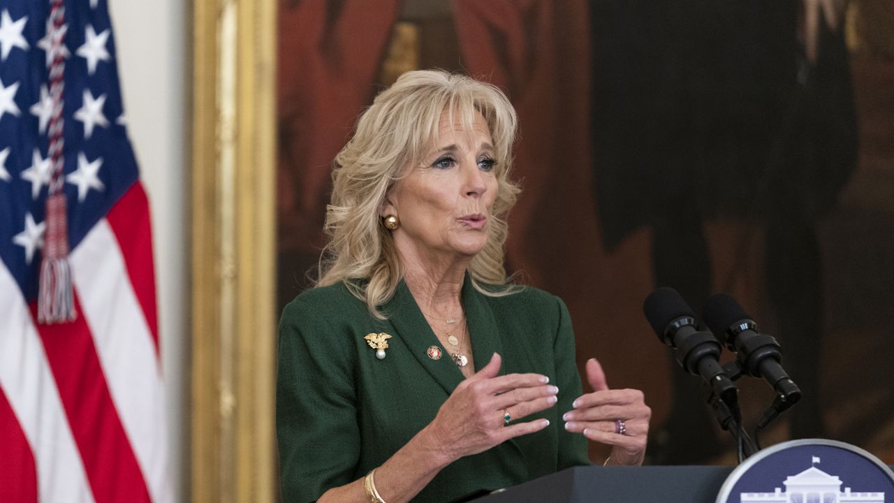 First lady Jill Biden speaks during a ceremony in the East Room of the White House honoring children in military and veteran caregiving families, Wednesday, Nov. 10, 2021. (AP Photo/Manuel Balce Ceneta)