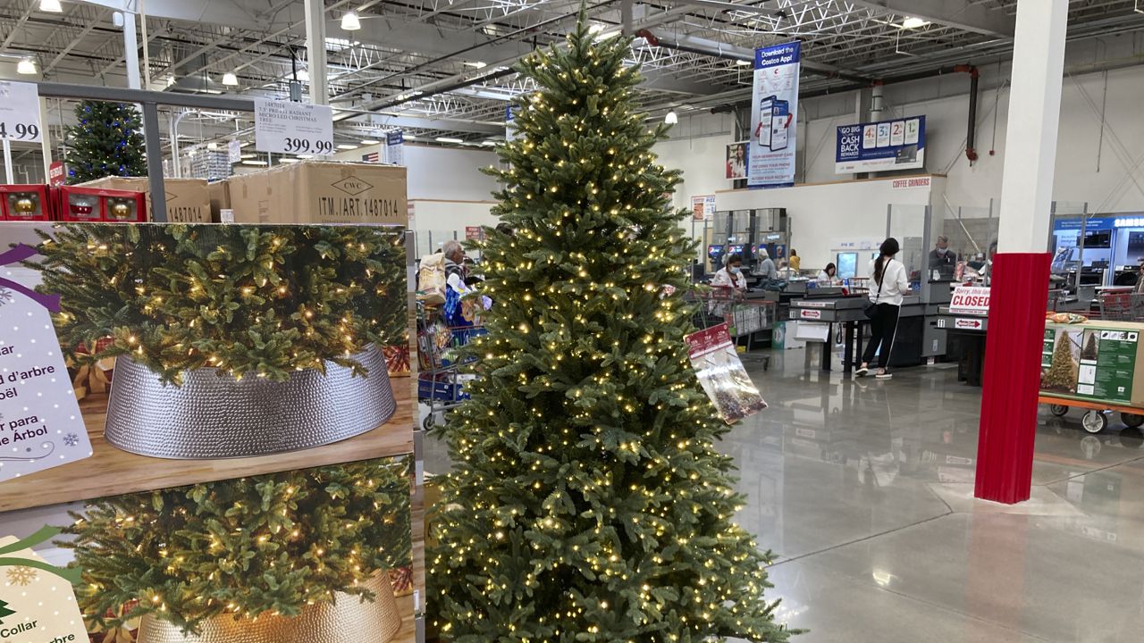 FILE: A display of a Christmas tree sits near the checkout stands in a Costco warehouse Thursday, Nov. 11, 2021, in Sheridan, Colo. (AP Photo/David Zalubowski)