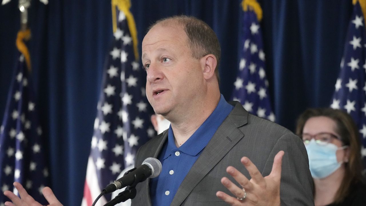 FILE - Colorado Gov. Jared Polis speaks during a news conference about Colorado offering coronavirus vaccinations to children, Thursday, Oct. 28, 2021, in Denver. (AP Photo/David Zalubowski, File)