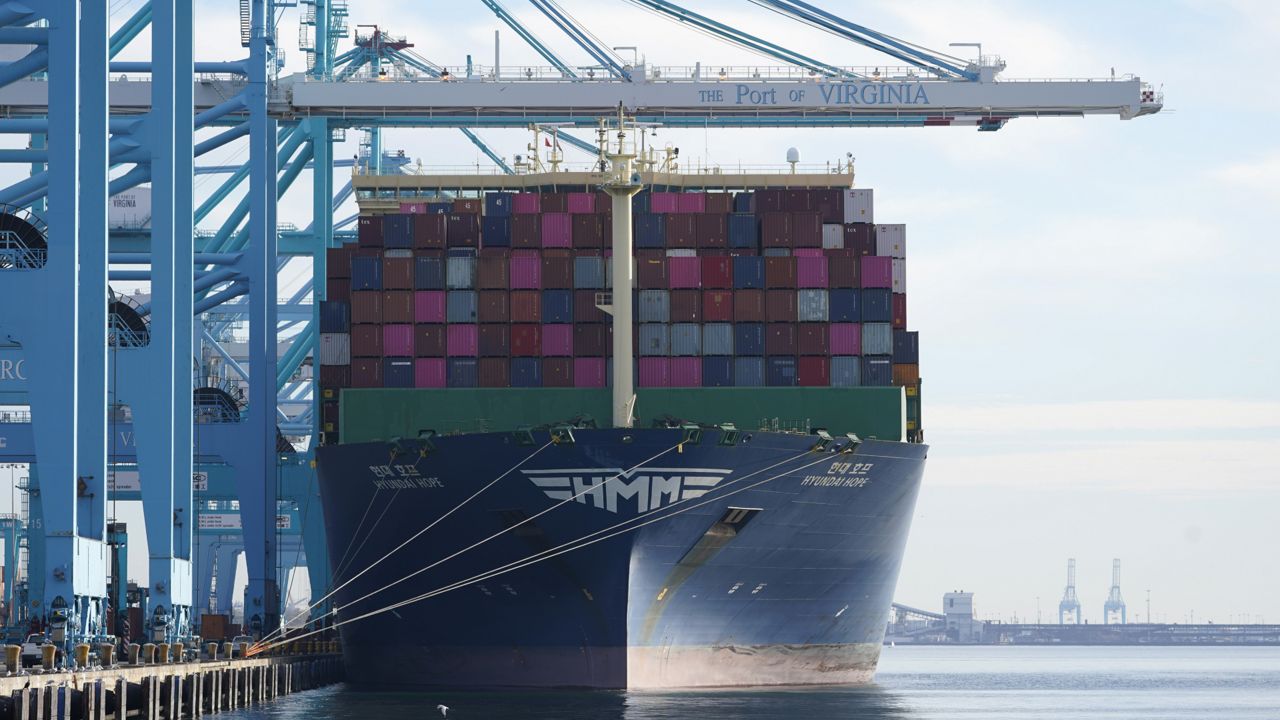 FILE: The container ship Hyundai Hope sits pier side as it is loaded at the Norfolk International Terminal Wednesday Dec 1, 2021, in Norfolk, Va. (AP Photo/Steve Helber)