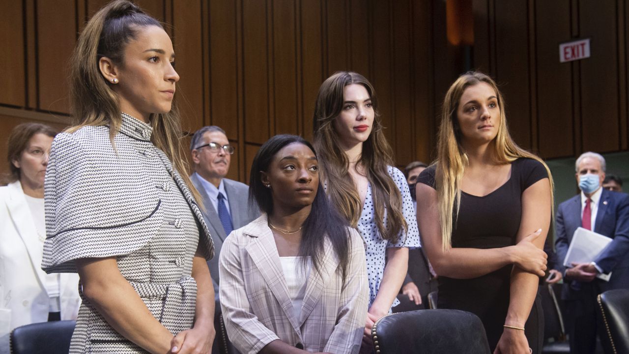 FILE: United States gymnasts from left, Aly Raisman, Simone Biles, McKayla Maroney and Maggie Nichols, leave after testifying at a Senate Judiciary hearing about the Inspector General's report on the FBI's handling of the Larry Nassar investigation on Capitol Hill, Wednesday, Sept. 15, 2021, in Washington. (Saul Loeb/Pool via AP)