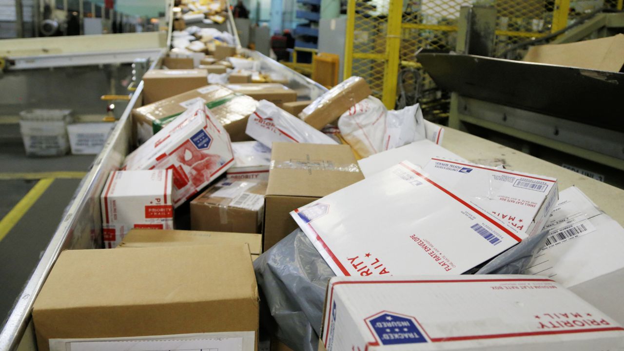 FILE: Packages travel on a conveyor belt for sorting at the main post office in Omaha, Neb. (AP Photo/Nati Harnik)