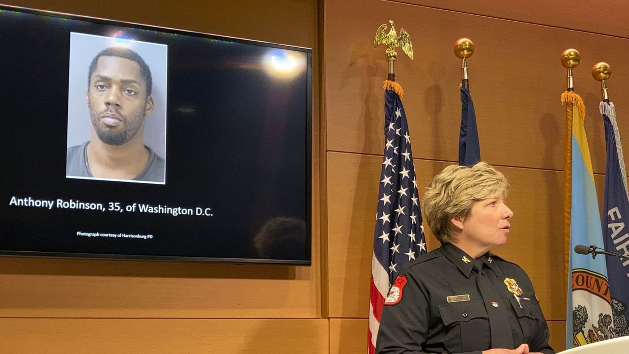 Harrisonburg, Va., Police Chief Kelley Warner discussing murder charges against Anthony Robinson, 35, of Washington, D.C. , at a press conference Friday, Dec. 17, 2021, in Fairfax, Va. (AP Photo/Matthew Barakat)