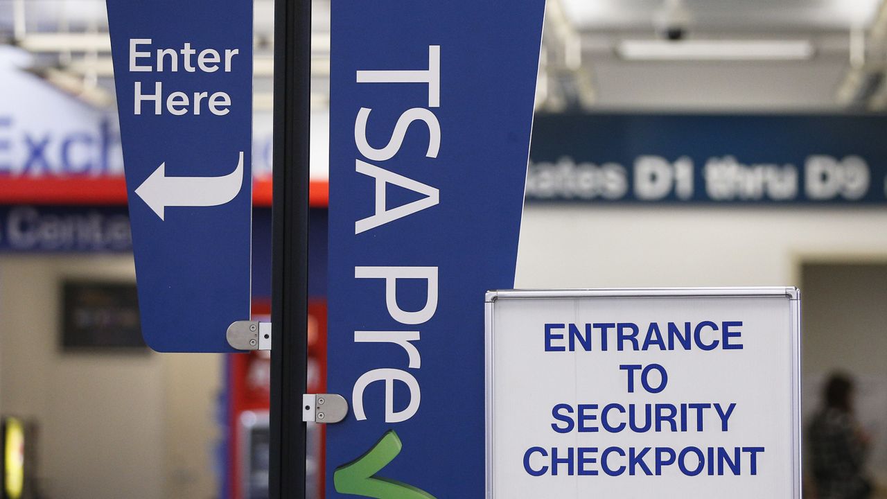 A TSA pre check sign at a security checkpoint is on display for travelers to easily see at the Fort Lauderdale–Hollywood International Airport. (AP Photo/Brynn Anderson)