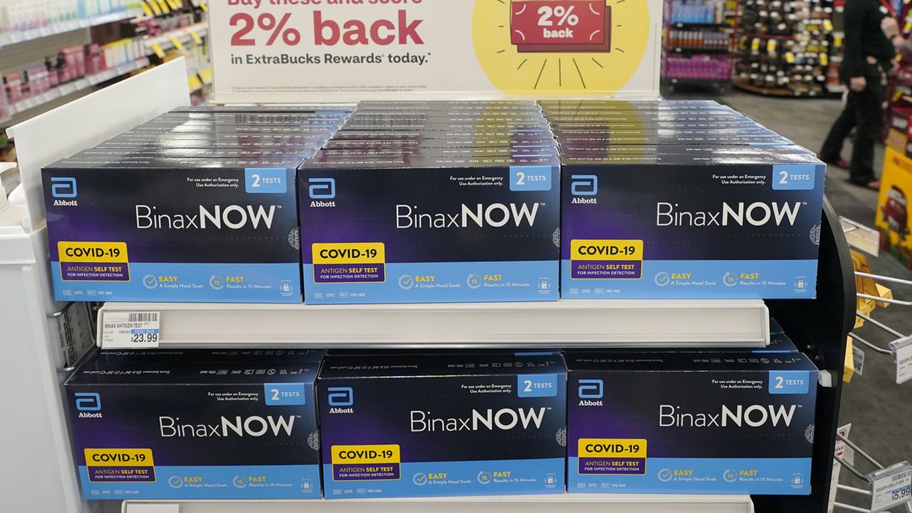FILE - Boxes of BinaxNow home COVID-19 tests made by Abbott are shown for sale on Nov. 15, 2021, at a CVS store in Lakewood, Wash. (AP Photo/Ted S. Warren, File)