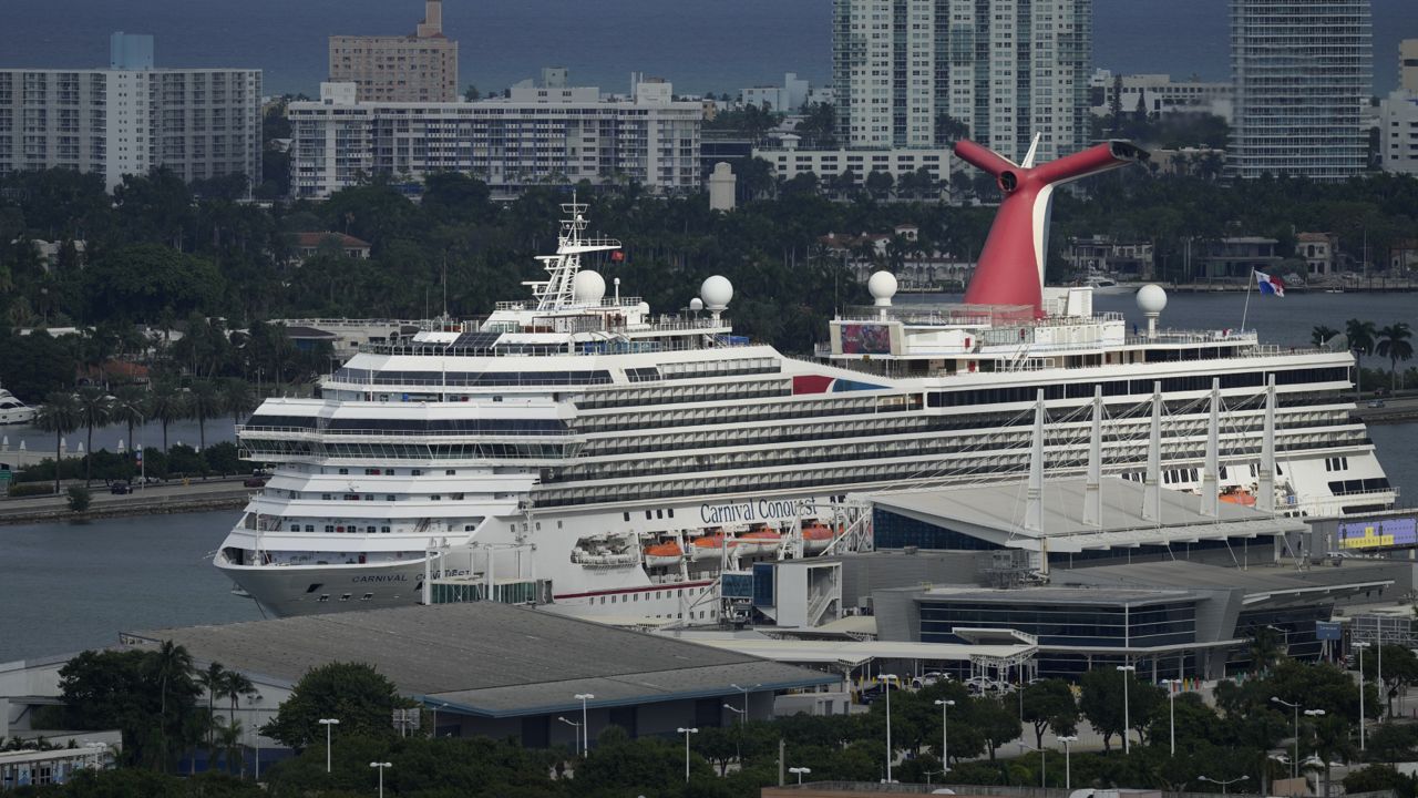 The Carnival Conquest cruise ship sits docked at port, Wednesday, Oct. 20, 2021, in Miami.(AP Photo/Rebecca Blackwell)