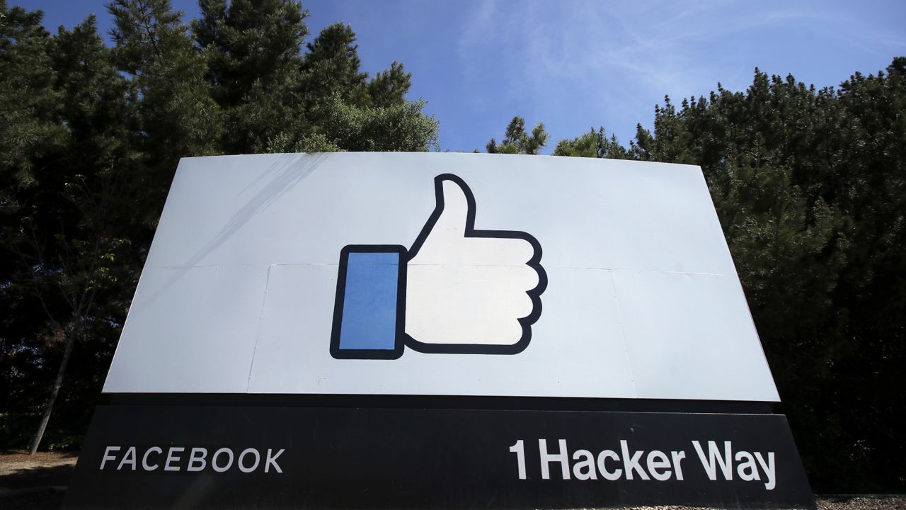 FILE - In this April 14, 2020 file photo, the thumbs up Like logo is shown on a sign at Facebook headquarters in Menlo Park, Calif. (AP Photo/Jeff Chiu, File)