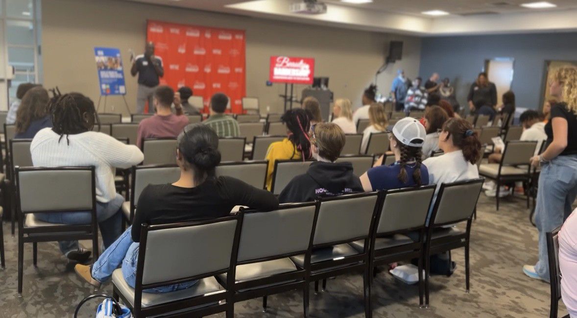 Students at Queens University of Charlotte attend an  event called Beauty and Barbershop: A Conversation About the 2024 Elections aimed at engaging young students of color in the voting process. (Spectrum News 1/Jennifer Roberts)