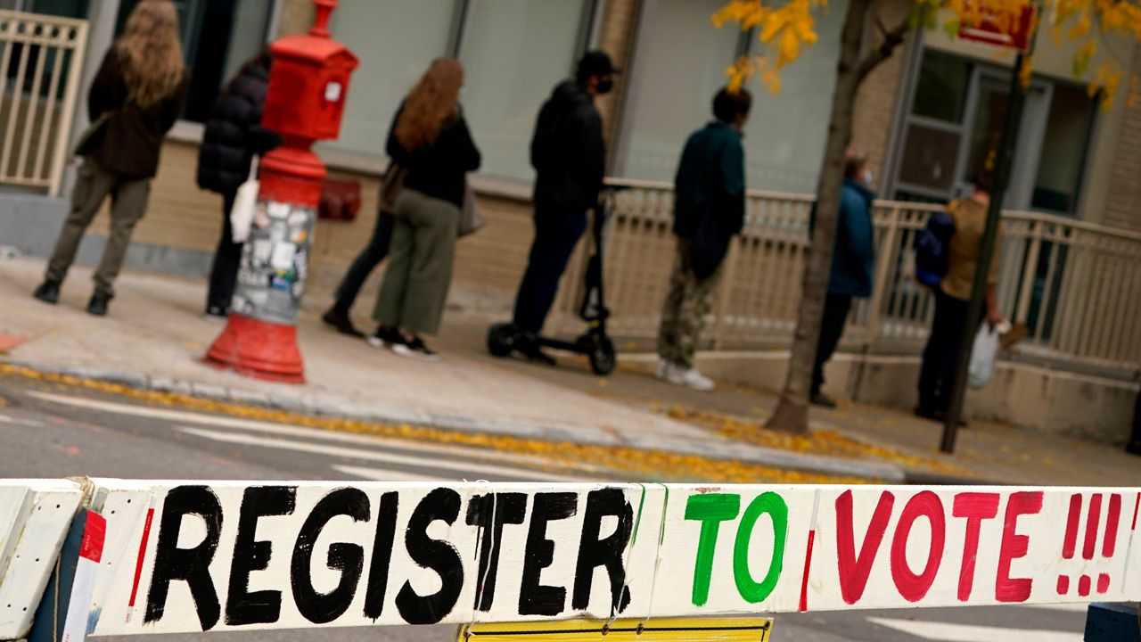 People lining up to register to vote in New York, October 2020. (AP Photo/Seth Wenig)