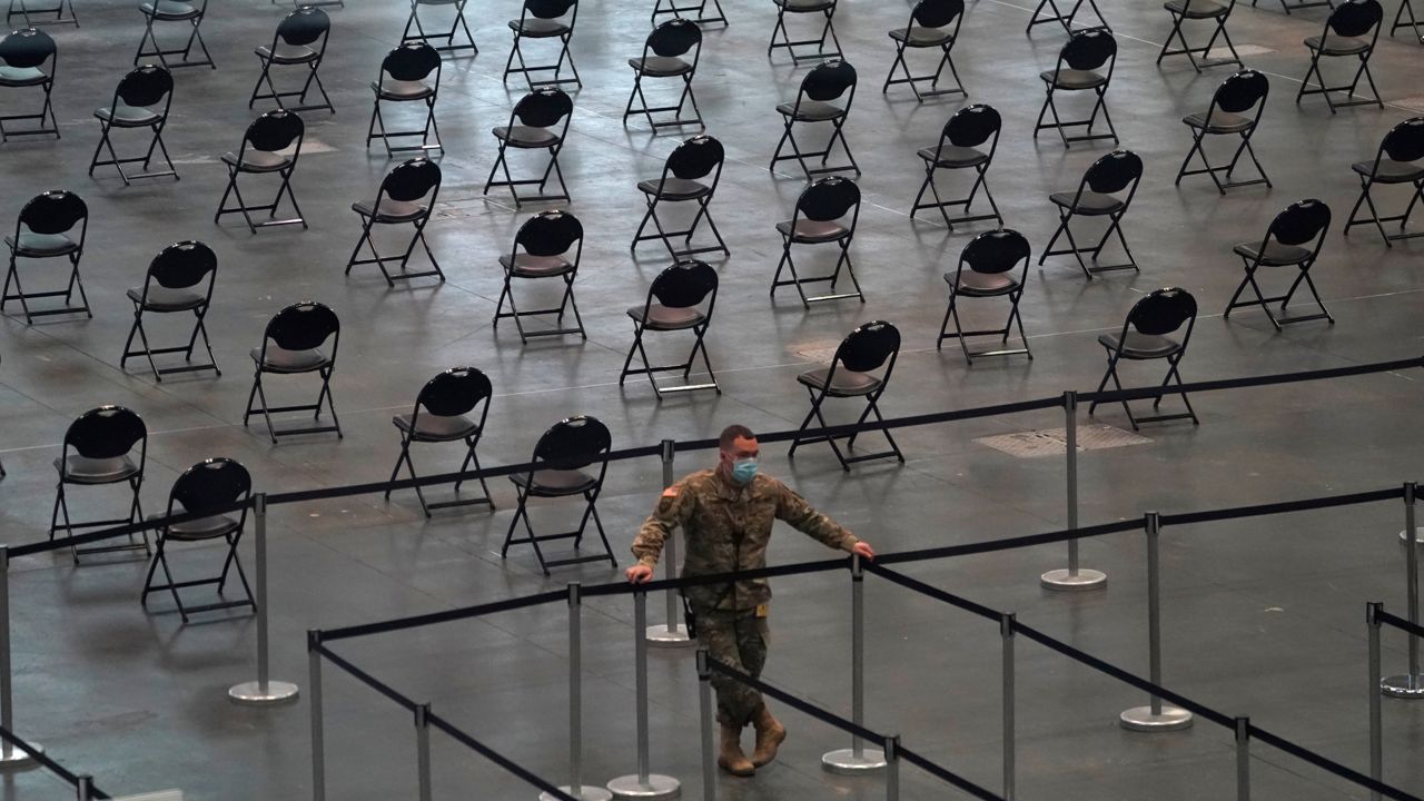 A member of the National Guard at the Javits Convention Center, a major vaccine hub in Manhattan, April 6, 2021. (Timothy A. Clary/Pool Photo via AP)