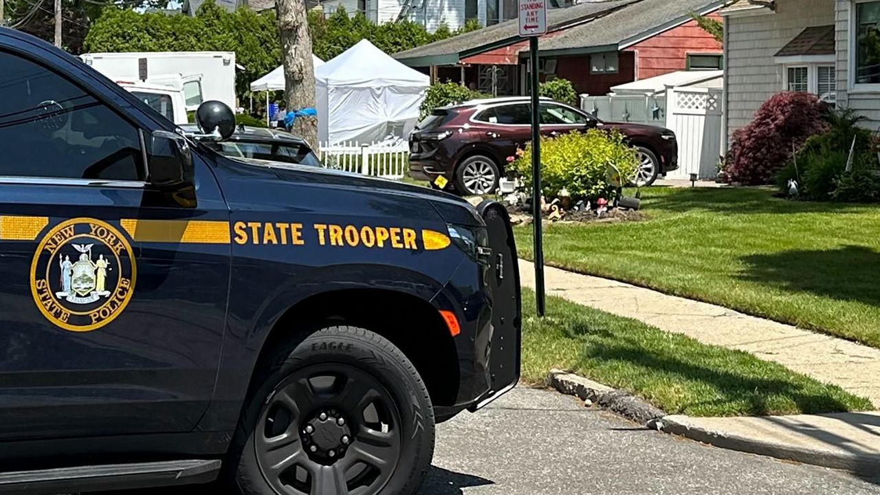 White tents set up by law enforcement fill the front yard of Rex Heuermann's home in Massapequa Park on Monday, May 20, 2024.