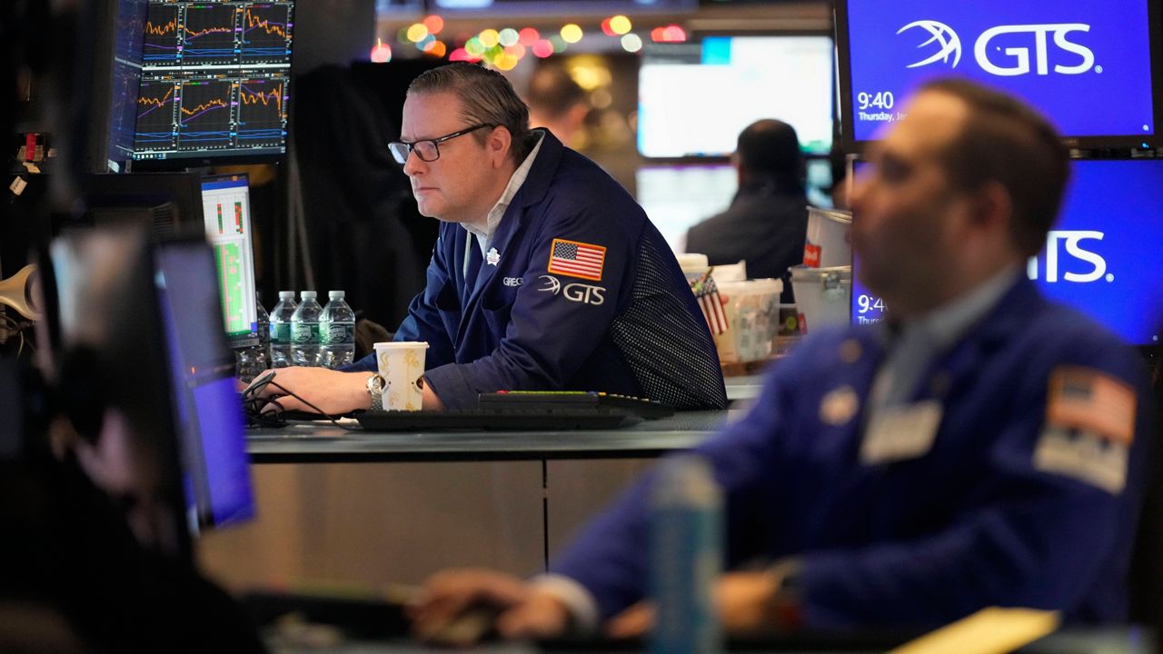 Traders work on the floor at the New York Stock Exchange in New York's Financial District Thursday, Jan. 2, 2025. (AP Photo/Seth Wenig, File)