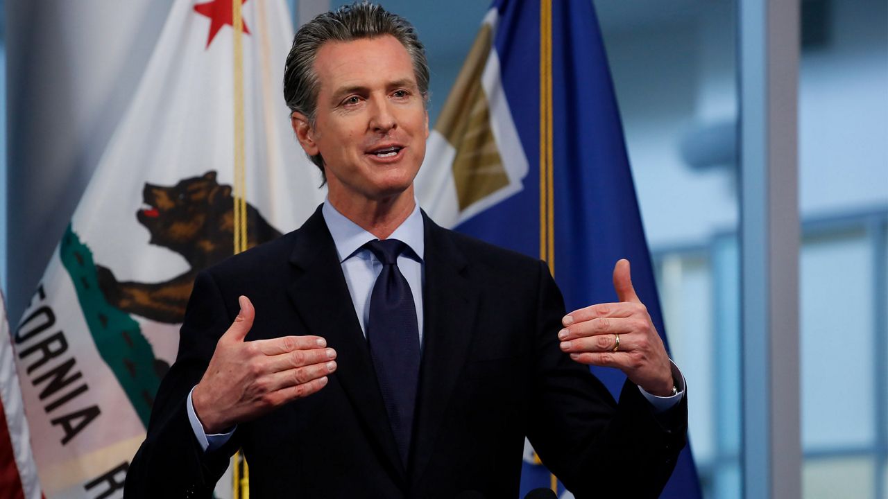In this April 9, 2020 file photo Gov. Gavin Newsom discusses the state's response to the coronavirus during his daily news briefing at the Governor's Office of Emergency Services in Rancho Cordova, Calif. Newsom said Monday, April 13, 2020 that he will announce a detailed plan on Tuesday for how the state will eventually lift coronavirus restrictions. (AP Photo/Rich Pedroncelli, File )