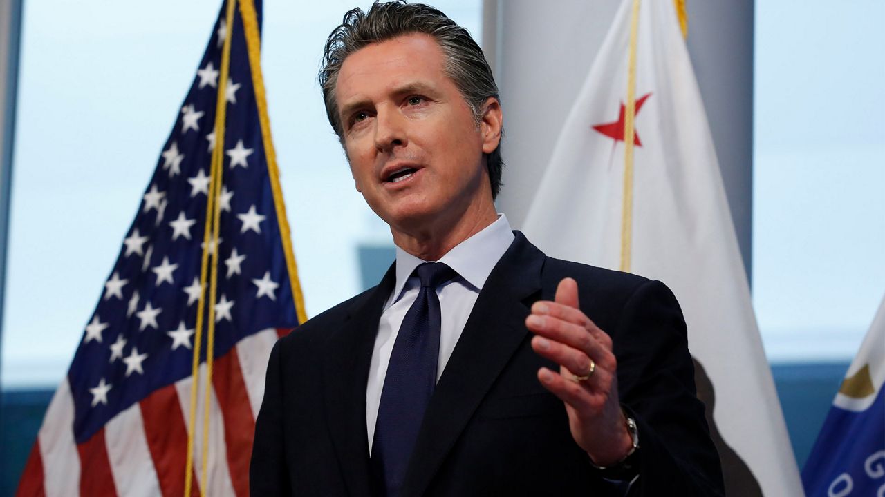 FILE - In this March 30, 2020, file photo, Gov. Gavin Newsom speaks at the Governor's Office of Emergency Services in Rancho Cordova, Calif. Gov. Newsom says the state is exploring ways to help people living in the country illegally who are not eligible for federal economic stimulus benefits. Newsom said Tuesday, April 7, 2020, he plans to unveil his plan next month. He said it is part of a broader package of economic stimulus strategies at a state level that are separate from federal benefits. (AP Photo/Rich Pedroncelli, File)