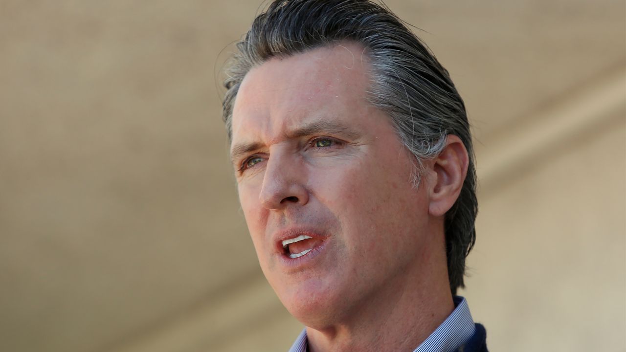 California Gov. Gavin Newsom gives an update on the state's initiative to provide housing for homeless Californians to help stem the coronavirus, during a visit to a Motel 6 participating in the program in Pittsburg, Calif., Tuesday, June 30, 2020. On Wednesday, July 1, 2020, Newsom ordered restaurants and other public places in 19 counties to close their indoor operations for the next three weeks because of increases in coronavirus cases and hospitalizations. (AP Photo/Rich Pedroncelli, Pool)