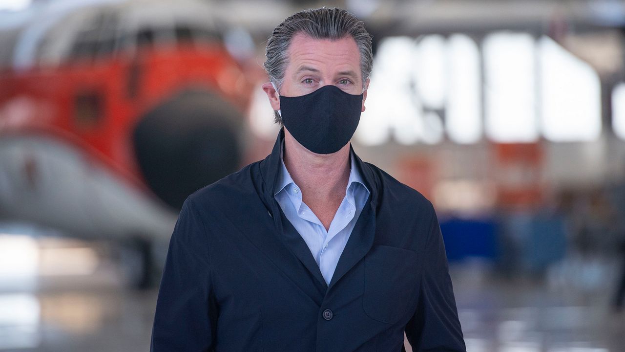 California Gov. Gavin Newsom visits the Cal Fire McClellan Reload Base in Sacramento, Calif., Thursday, July 9, 2020, to discuss the state's new efforts to protect emergency personnel and evacuees from COVID-19 during wildfires. (AP Photo/Hector Amezcua, Pool)