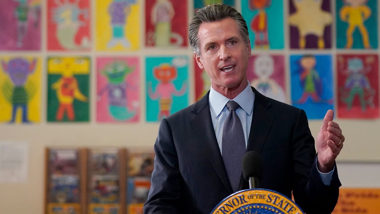 Gov. Gavin Newsom speaks at a news conference at James Denman Middle School in San Francisco, Friday, Oct. 1, 2021. (AP Photo/Jeff Chiu)