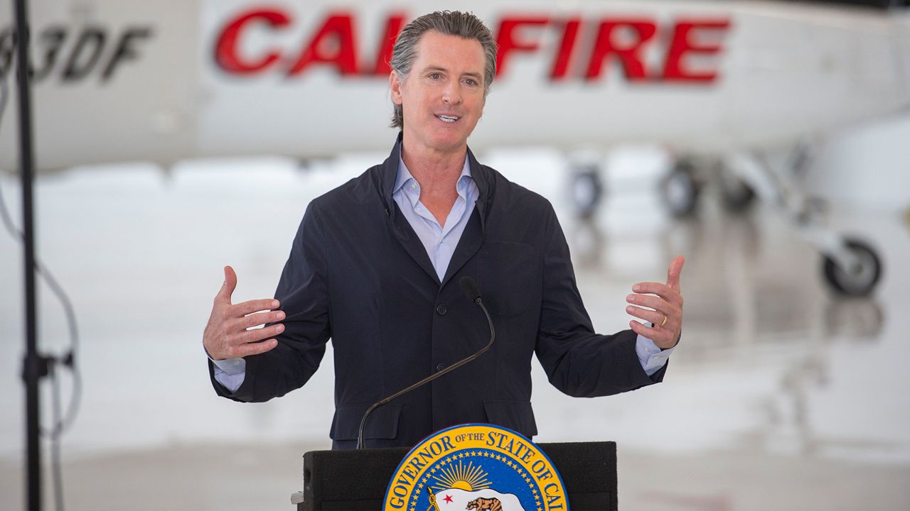 California Gov. Gavin Newsom visits the California Department of Forestry and Fire Protection's McClellan Reload Base in Sacramento, Calif., Thursday, July 9, 2020, to discuss the state's new efforts to protect emergency personnel and evacuees from COVID-19 during wildfires. (AP Photo/Hector Amezcua, Pool)