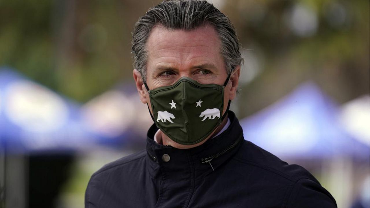California Gov. Gavin Newsom wears a mask during a visit to a vaccination center in South Gate, Calif. on March 10, 2021. (AP Photo/Marcio Jose Sanchez)
