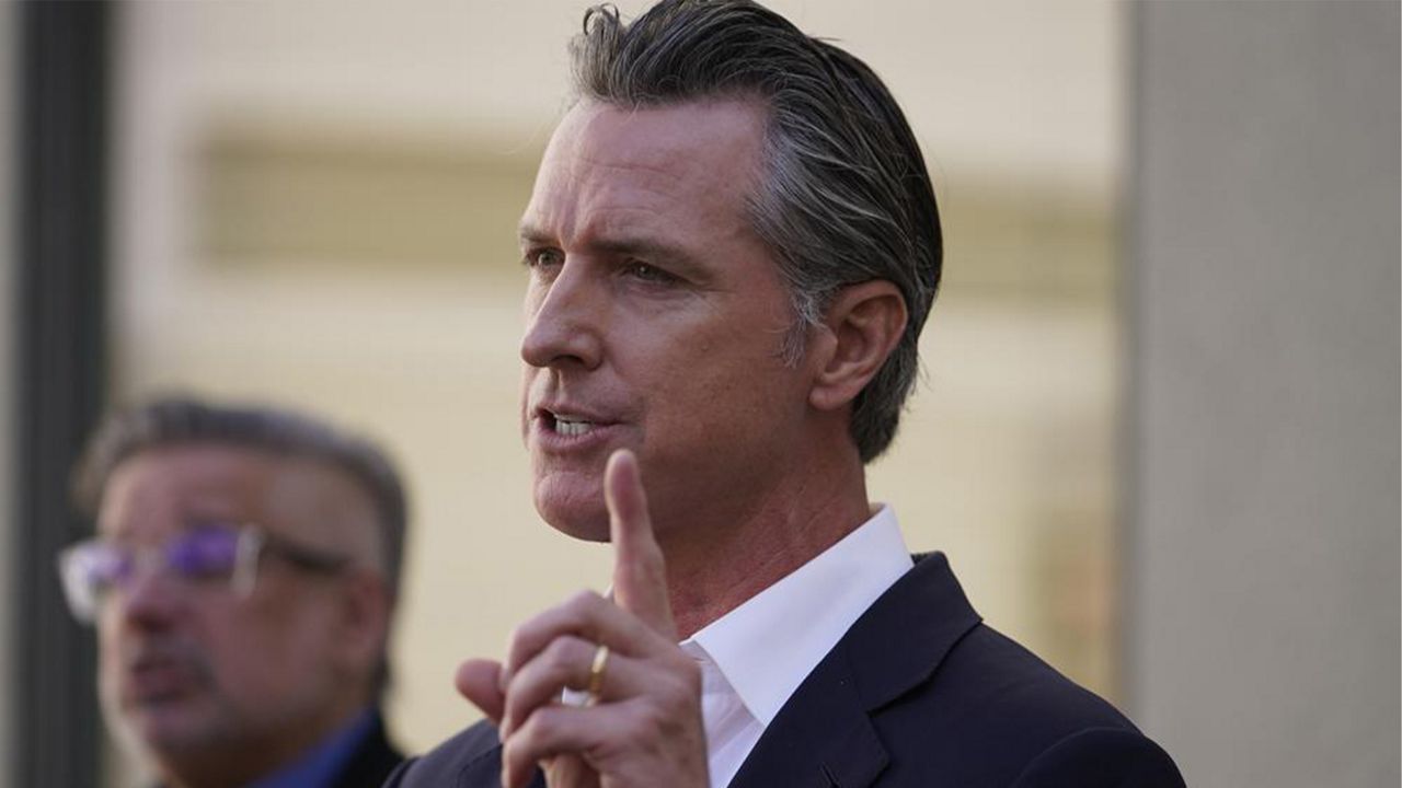 California Gov. Gavin Newsom takes questions from the media after a visit to a COVID-19 vaccine clinic at the VA Greater Los Angeles Healthcare System to promote vaccinations and booster shots in Los Angeles on Wednesday, Nov. 10, 2021. Boosters have been approved for the Pfizer, Moderna and Johnson & Johnson COVID-19 vaccines. (AP Photo/Damian Dovarganes)