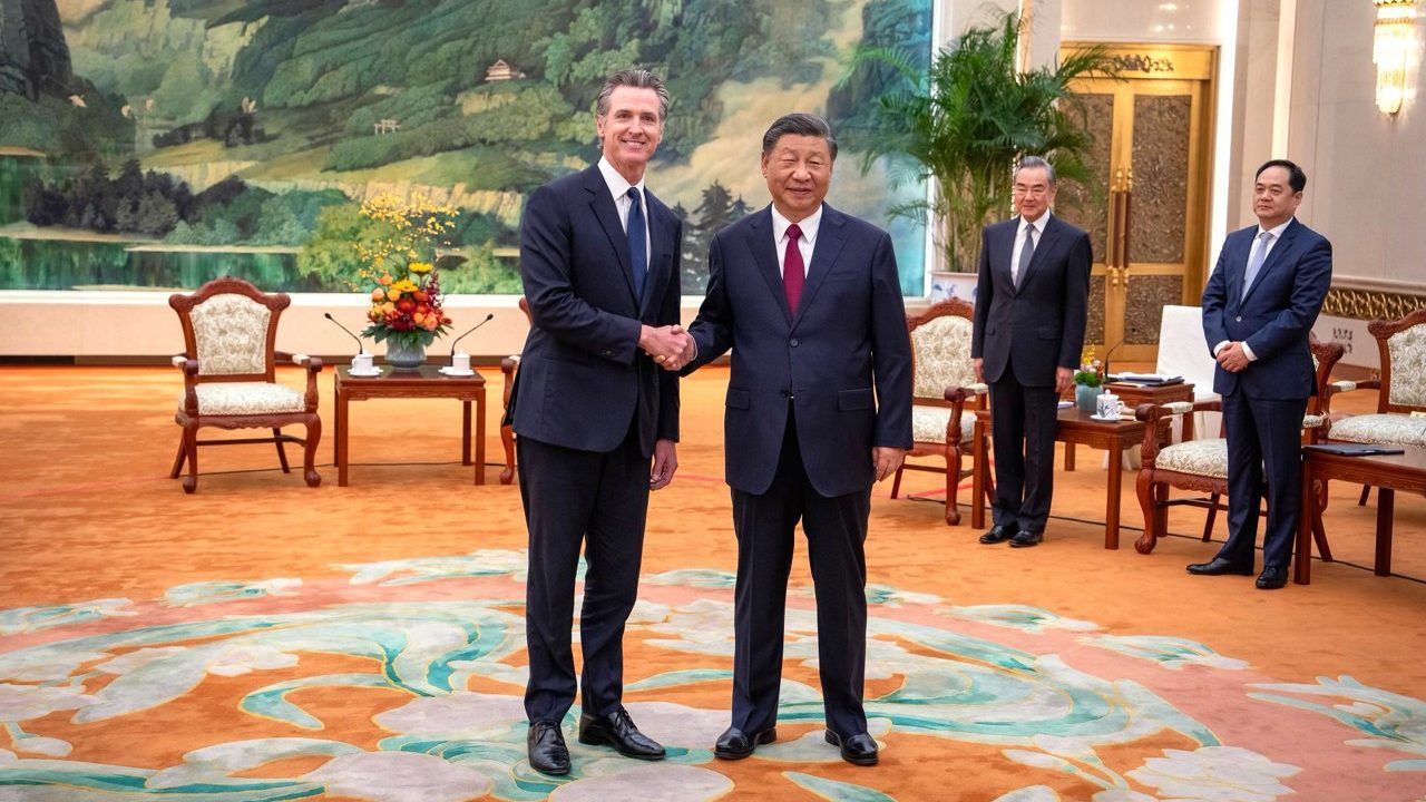 In this photo taken Wednesday and released by the Office of the Governor of California, Gov. Gavin Newsom, left, meets with Chinese President Xi Jinping at the Great Hall of the People in Beijing. (Office of the Governor of California via AP)