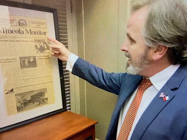 Sen. Bryan Hughes looks at a newspaper (LeAnn Wallace/Spectrum News 1)