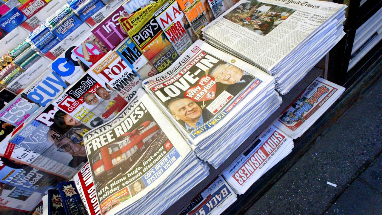 A stack of the New York Post, center, is on display alongside the other New York daily newspapers at a newsstand in Times Square, Wednesday, Oct. 19, 2005 in New York. (AP Photo/Mary Altaffer, File)