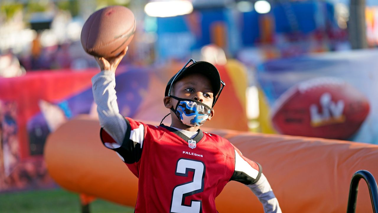 Isaiah Sheppard, 7, throws a football at the NFL Experience for Super Bowl LV Friday, Jan. 29, 2021, in Tampa, Fla. (David J. Phillip/AP)