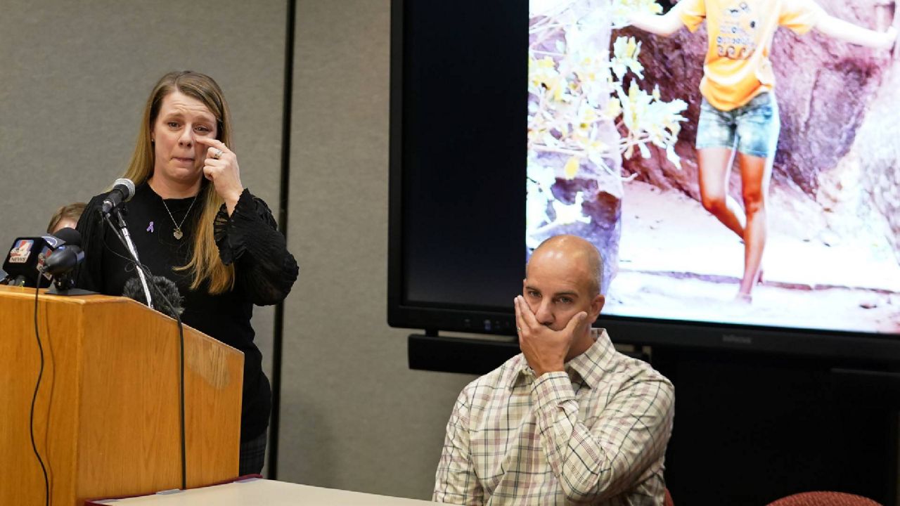 Gabby Petito's mother, Nichole Schmidt, speaks during a news conference as her husband, Jim Schmidt, looks on, Thursday, Nov. 3, 2022, in Salt Lake City. The families of Petito and Brian Laundrie have reached a $3 million settlement in a wrongful death lawsuit filed after authorities concluded he strangled her during a cross-country trip in August 2021. (AP Photo/Rick Bowmer, File)