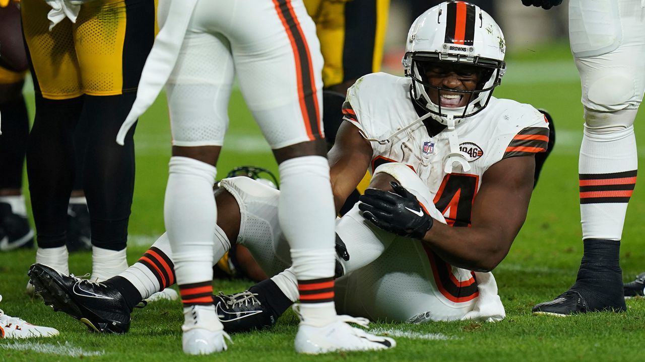 Cleveland Browns running back Nick Chubb, grimaces on the field after an injury during the first half of an NFL football game against the Pittsburgh Steelers Monday, Sept. 18, 2023, in Pittsburgh. (AP Photo/Matt Freed)