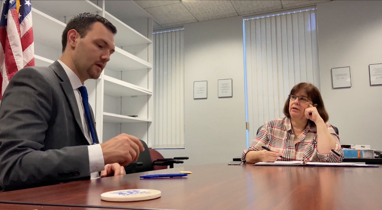 Burbank City Council candidate Nick Schultz talks with his senior advisor, Shanna Ingalsbee