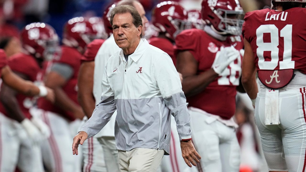 Alabama coach Nick Saban watches players warm up for the College Football Playoff championship NCAA football game against Georgia on Jan. 10, 2022, in Indianapolis. Saban called out Texas A&M on Wednesday night, May 18 for “buying” players in its top-ranked recruiting class with name, image and likeness deals, saying Crimson Tide football players earned more than $3 million last year “the right way.” (AP Photo/Paul Sancya, File)