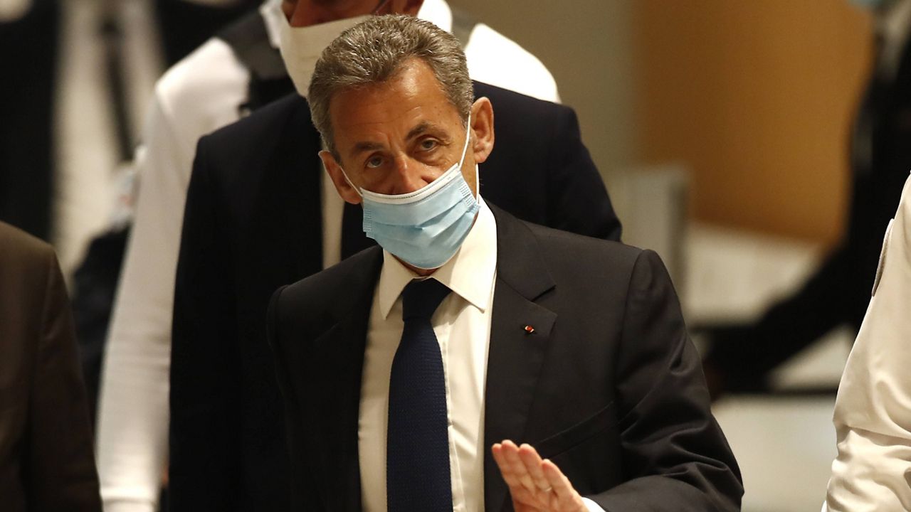 Former French President Nicolas Sarkozy arrives at court Monday in Paris. (AP Photo/Michel Euler)
