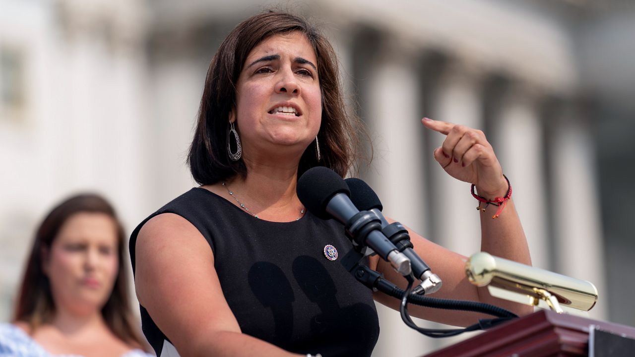 Rep. Nicole Malliotakis, R-N.Y., accompanied by House Republican Conference chair Rep. Elise Stefanik, R-N.Y., left, speaks at a news conference on the steps of the Capitol in Washington, Thursday, July 29, 2021. (AP Photo/Andrew Harnik)