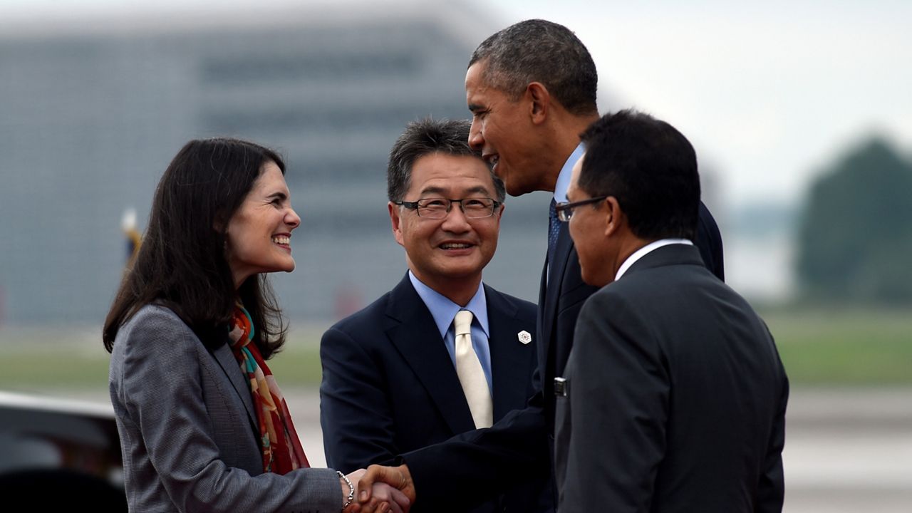 President Barack Obama shakes hands with Nina Hachigian, U.S. Ambassador to ASEAN, after arriving at Subang Airbase in Kuala Lumpur, Malaysia, Friday, Nov. 20, 2015. Obama is traveling to Malaysia where he will join leaders from Southeast Asia to discuss trade and economic issues, and terrorism and disputes over the South China Sea. (AP Photo/Susan Walsh)