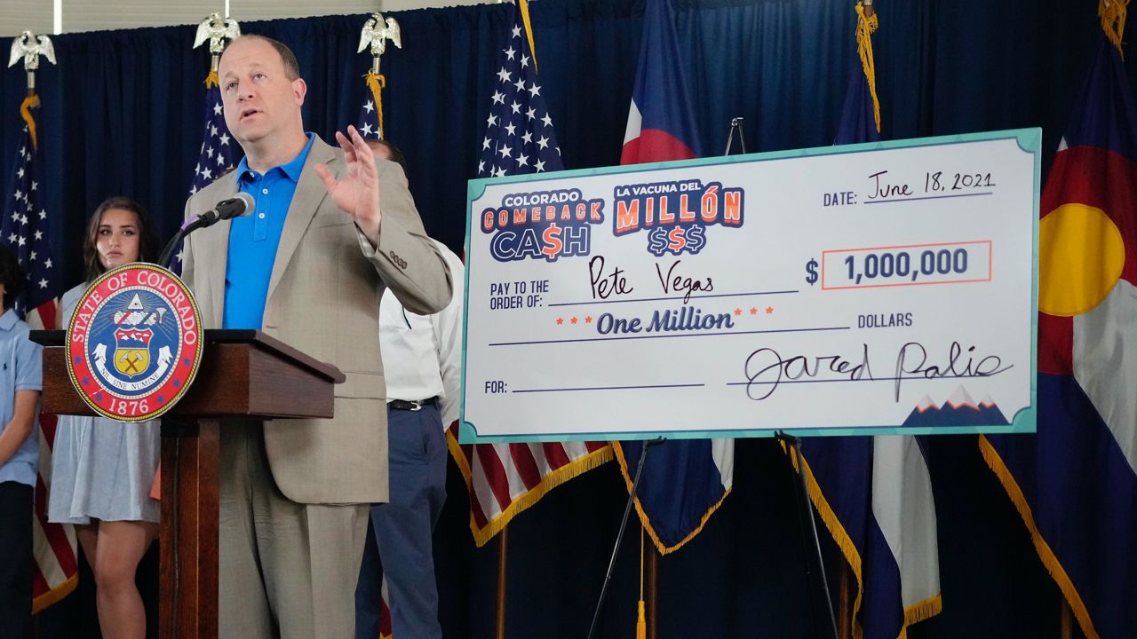 Colorado Governor Jared Polis speaks at an announcement of the state's weekly $1 million vaccine lottery winners on June 18, 2021, in Denver. (AP Photo/David Zalubowski)
