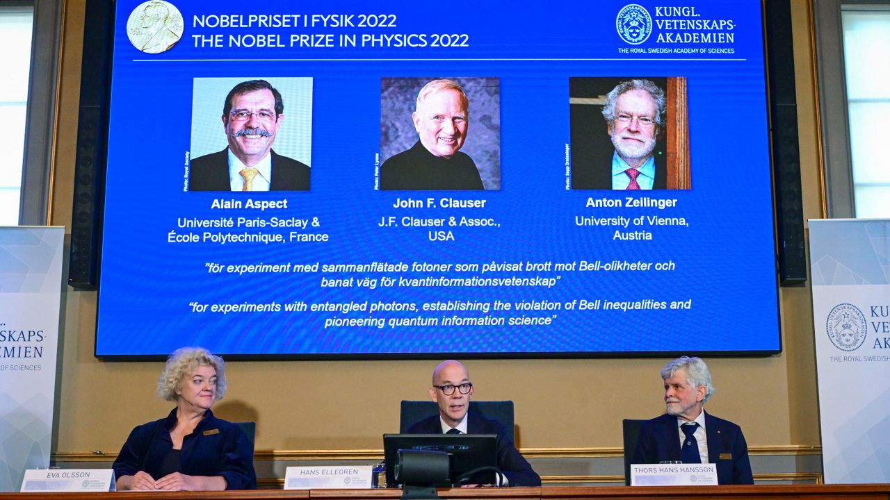 Secretary General of the Royal Swedish Academy of Sciences Hans Ellegren, center, and members of the Nobel Committee for Physics announce the winners Tuesday in Stockholm. (Jonas Ekstromer /TT News Agency via AP)