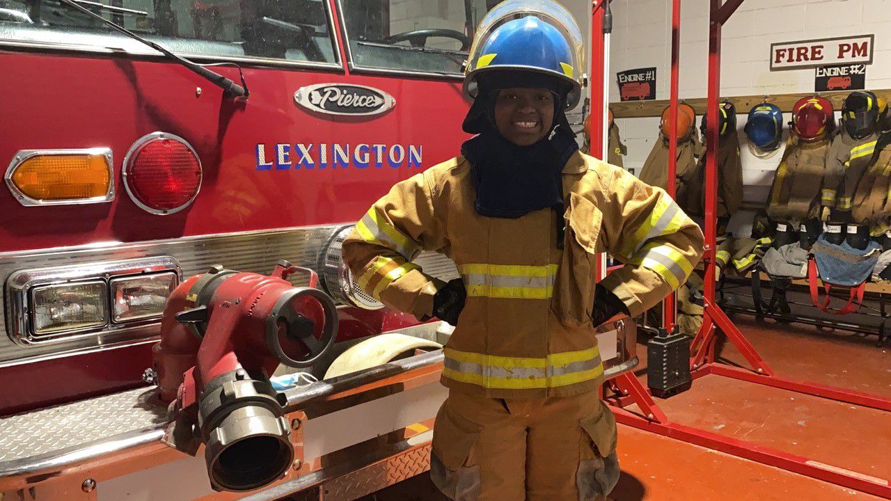 Nola Lewis smiles in her fire gear at Eastside Technical Center. (Spectrum News 1/Diamond Palmer)