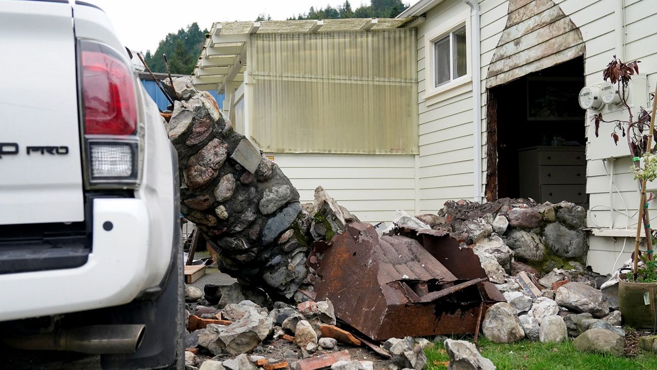 A home damaged by an earthquake can be seen in Rio Dell, Calif., Tuesday, Dec. 20, 2022. (AP Photo/Godofredo A. Vásquez)