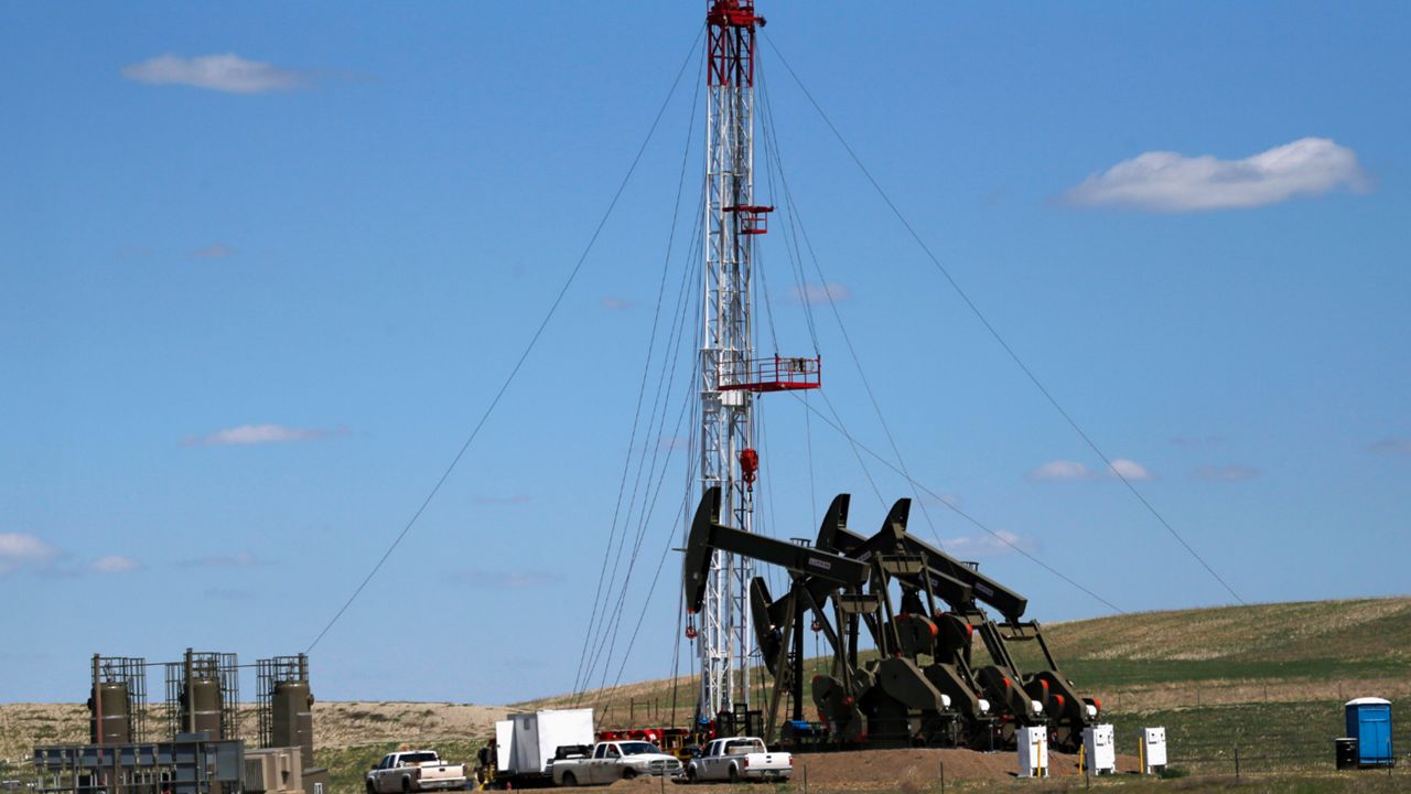 An oil rig and pumps in Watford City, N.D. (AP)